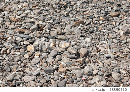 Grey stones at the beach by the lake Como, natural 58390510