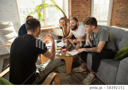 Group of young caucasian office workers have creative meeting to discuss new ideas Group of young caucasian office workers have creative meeting to discuss new ideas 58392151