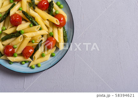 Penne pasta salad with asparagus , tomatoes and Penne pasta salad with asparagus , tomatoes and 58394621