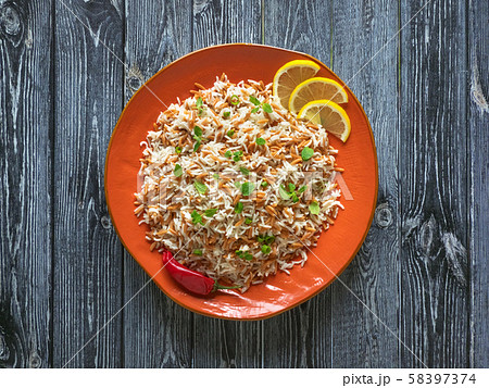 Oriental rice pilaf with orzo in a plate. Top view 58397374