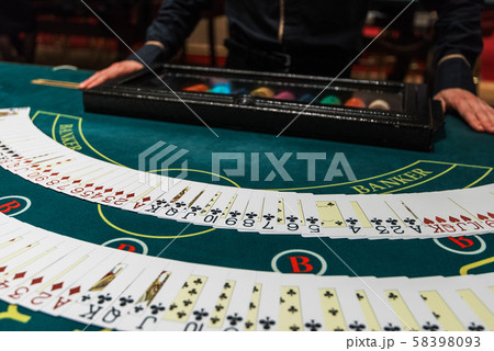 Professional croupier during cards Professional croupier during cards 58398093