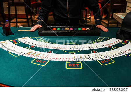 Professional croupier during cards Professional croupier during cards 58398097