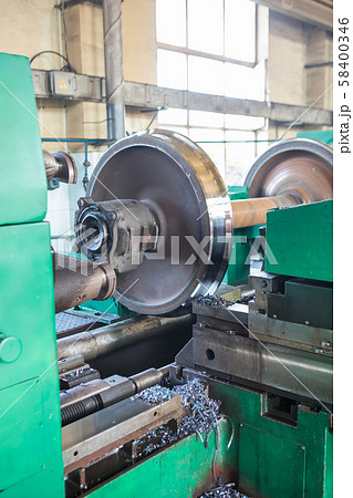 Rail wheelset in a lathe. Repair shop of railway 58400346