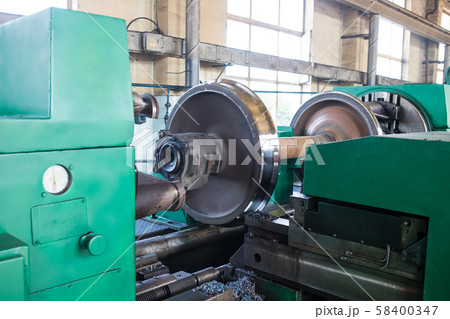 Rail wheelset in a lathe. Repair shop of railway 58400347