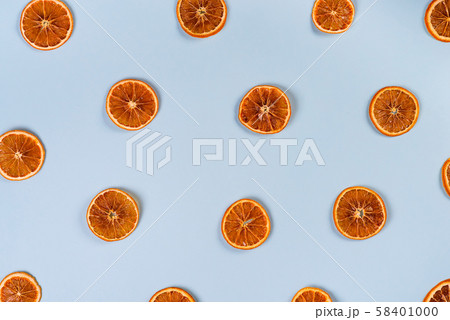 Dried slices of orange pattern on blue background 58401000