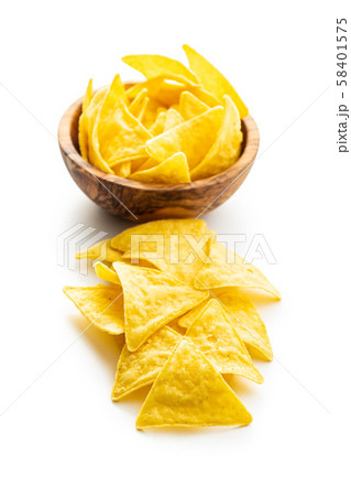 Corn nacho chips. Yellow tortilla chips in bowl. 58401575