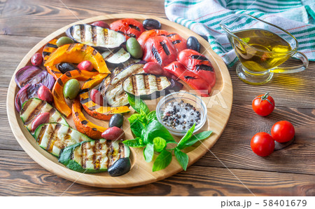 Grilled vegetables on the wooden tray Grilled vegetables on the wooden tray 58401679