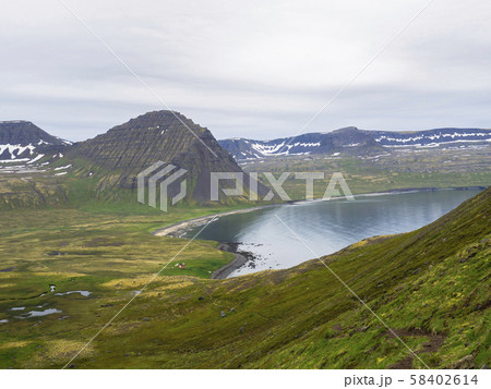 Northern summer landscape, View on beautiful snow covered cliffs and Alfsfell mountain, Hloduvik Northern summer landscape, View on beautiful snow covered cliffs and Alfsfell mountain, Hloduvik 58402614