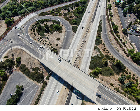 Aerial view of highway crossing a little town in California 58402952