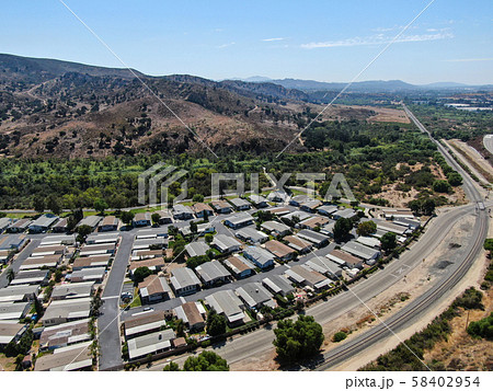 Aerial view of highway crossing a little town in California Aerial view of highway crossing a little town in California 58402954