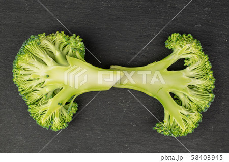 Fresh breen broccoli on grey stone Fresh breen broccoli on grey stone 58403945