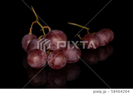 Rose wine grape isolated on black glass Rose wine grape isolated on black glass 58404204