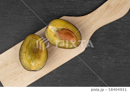 Fresh purple plum on grey stone 58404931