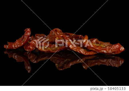 Dry red cherry tomato isolated on black glass Dry red cherry tomato isolated on black glass 58405133