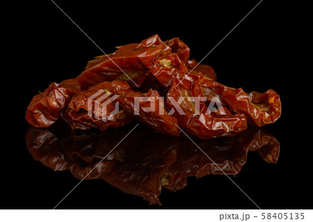 Dry red cherry tomato isolated on black glass 58405135