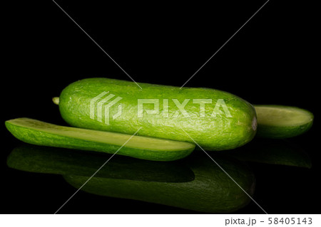 Fresh mini cucumber isolated on black glass Fresh mini cucumber isolated on black glass 58405143