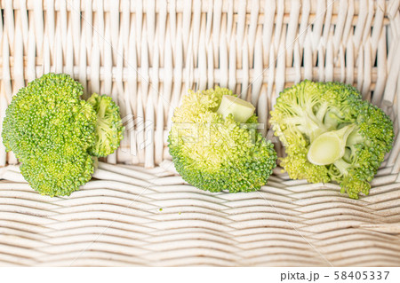 Fresh green broccoli with braided rattan Fresh green broccoli with braided rattan 58405337