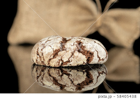 Chocolate brownie cookie isolated on black glass Chocolate brownie cookie isolated on black glass 58405438