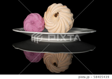 Fresh pastel sweet zefir isolated on black glass 58405439