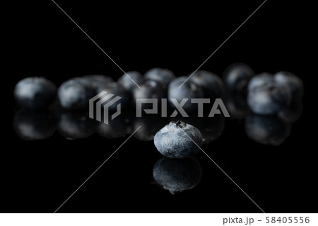 Fresh blueberry isolated on black glass 58405556