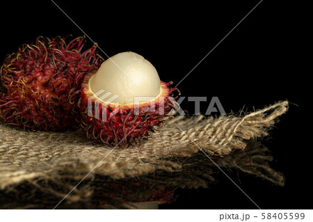 Fresh red rambutan isolated on black glass 58405599