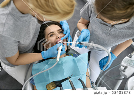 Pretty woman's teeth treatment in dental clinic Pretty woman's teeth treatment in dental clinic 58405878