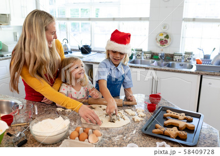 Family making Christmas cookies at home 58409728
