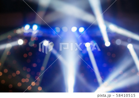 Abstract blurred photo of spotlight in conference hall, seminar and party environment concept Abstract blurred photo of spotlight in conference hall, seminar and party environment concept 58410515