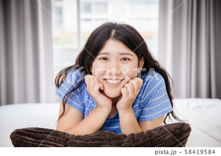 Asian girl young teen happy at home bedroom Asian girl young teen happy at home bedroom 58419584
