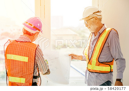 two builder engineer working together consulting two builder engineer working together consulting 58420177