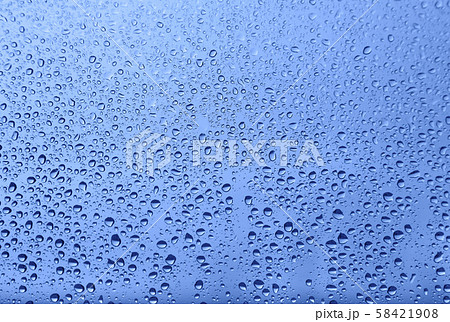 Water drops on glass, natural blue texture 58421908