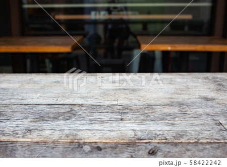wooden table  and blurred street scene in the 58422242
