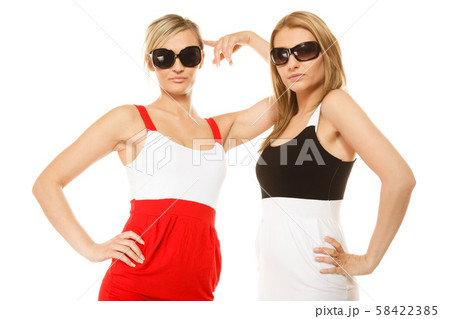 two sexy crazy women in summer clothes sunglasses. two sexy crazy women in summer clothes sunglasses. 58422385