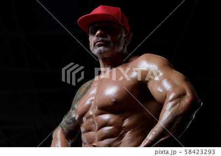 Handsome strong athletic men pumping up muscles Handsome strong athletic men pumping up muscles 58423293