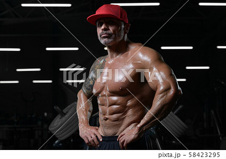 Handsome strong athletic men pumping up muscles Handsome strong athletic men pumping up muscles 58423295