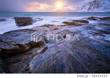 Coast of Norwegian sea on rocky coast in fjord on sunset 58424333