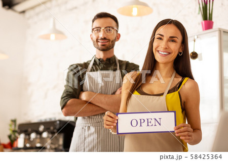 Couple feeling excited before opening their own coffee shop 58425364