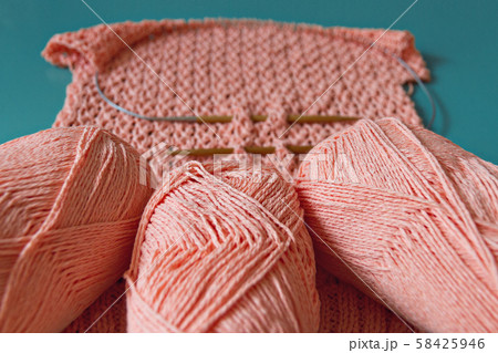 coral sweater made of cotton knitted with three skeins of coral yarn on openwork pattern and coral sweater made of cotton knitted with three skeins of coral yarn on openwork pattern and 58425946