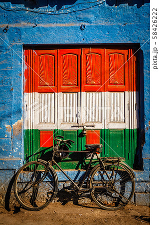 Bicycle and door painted in India national flag colors. Jodhpur, India 58426222