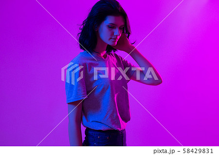 Young woman in pink blue neon lights. Creative colorful portrait Young woman in pink blue neon lights. Creative colorful portrait 58429831
