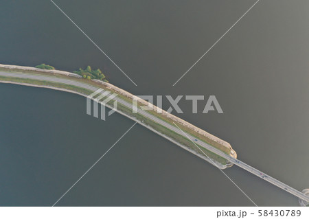 Auto going by asphalt road near sea 58430789