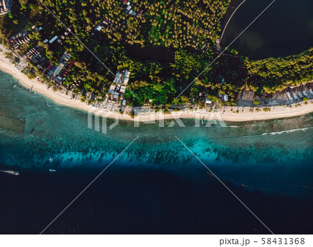 Tropical island with beach and ocean, aerial - Stock Photo 