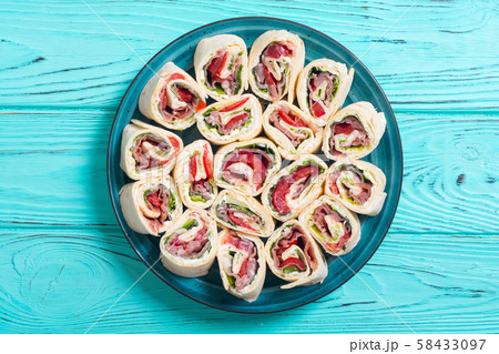 Sliced sandwich tortilla with vegetables and ham Sliced sandwich tortilla with vegetables and ham 58433097