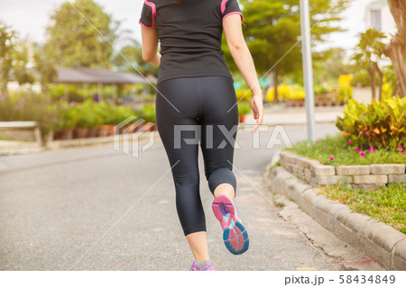 Women exercising. Runner woman running in the Women exercising. Runner woman running in the 58434849