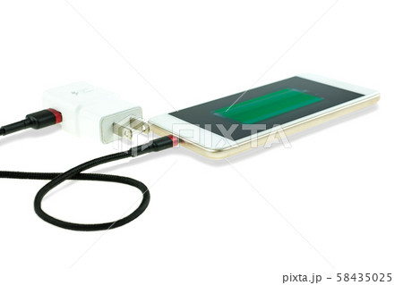 Adapter smart phone charger at plug in power outlet at white background Adapter smart phone charger at plug in power outlet at white background 58435025
