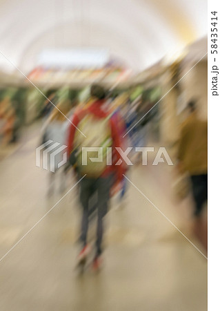 Abstract blurred image unrecognizable young guy with a backpack, group of people in arched corridor Abstract blurred image unrecognizable young guy with a backpack, group of people in arched corridor 58435414