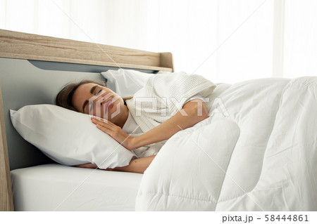 Young beautiful sleep in the bed at home. Young beautiful sleep in the bed at home. 58444861
