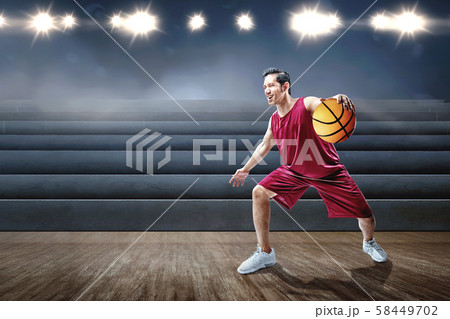 Asian man basketball player playing basketball 58449702