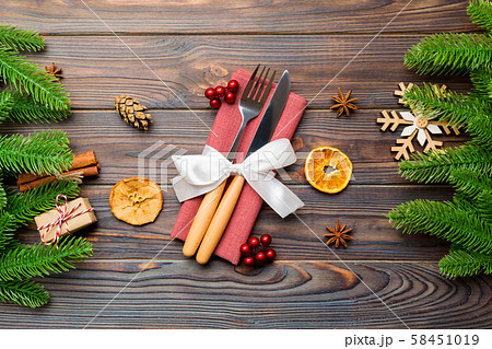 Top view of utensils on festive napkin on wooden 58451019