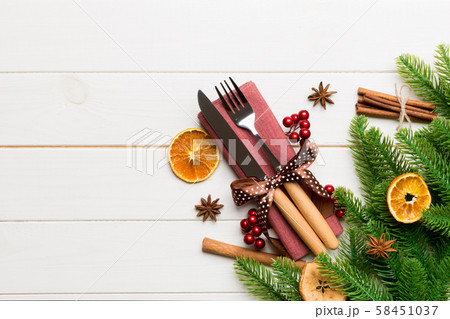 Top view of utensils on festive napkin on wooden Top view of utensils on festive napkin on wooden 58451037